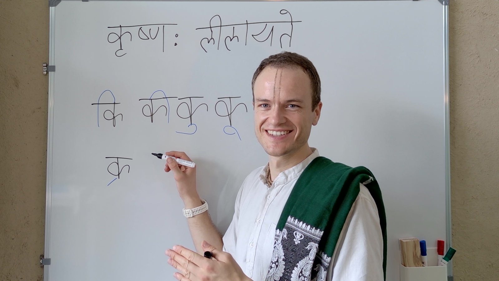 Vilasa teaching on the whiteboard